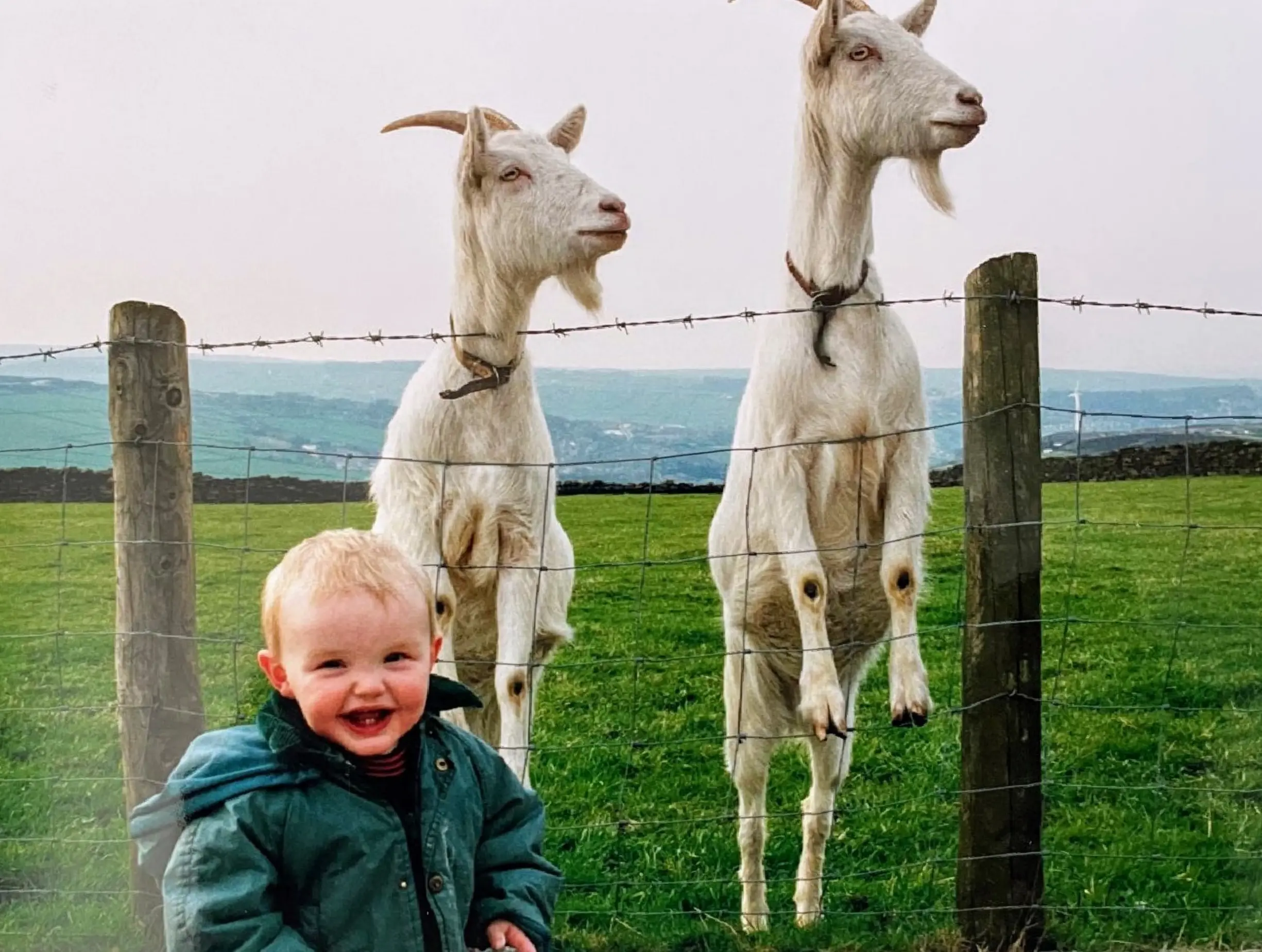 George with Heidi and Katie, two of his childhood goats, some time in the 1990's